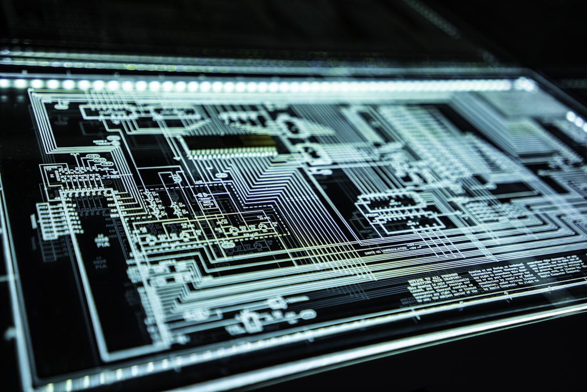 Illuminated circuit schematic representing cybersecurity