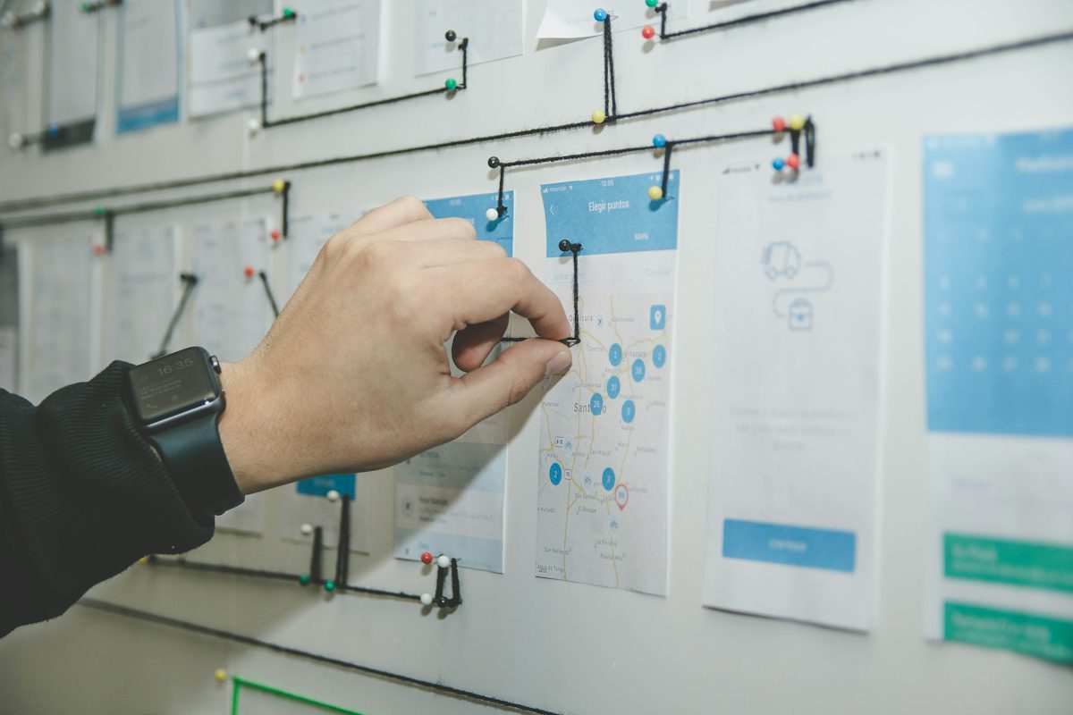 Planning wall of connected wireframes representing enterprise architecture