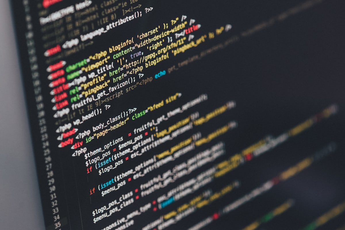 Source code on screen representing application development